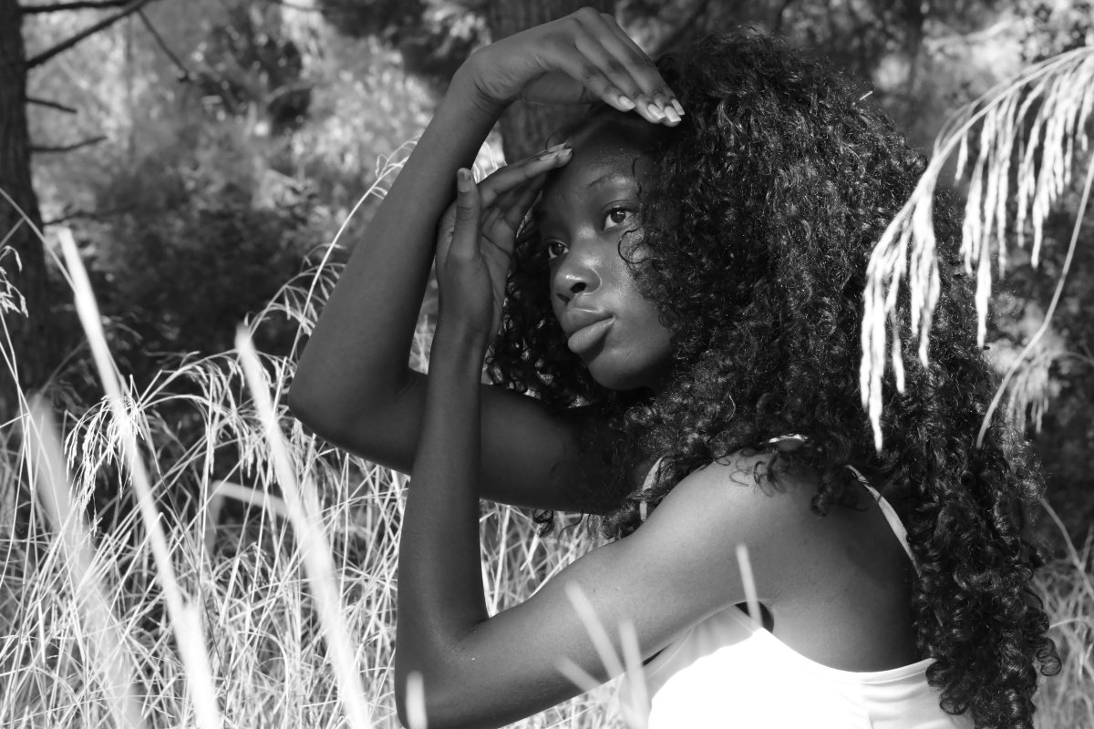 Luminous portrait of a young woman with a deep gaze, timeless beauty in black and white